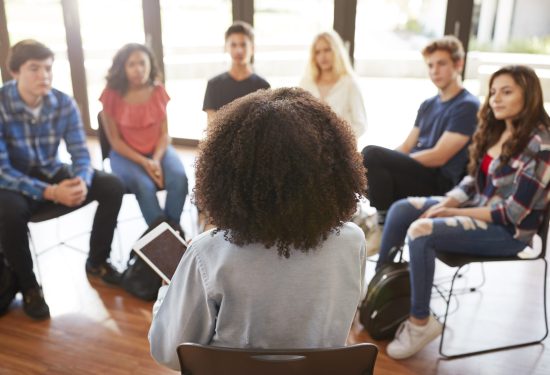 Students in conversation in a classroom